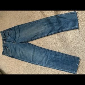 Blue jeans with frayed bottom